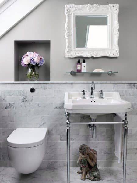two tone gray and tile wall white vanity white frame mirror flowers